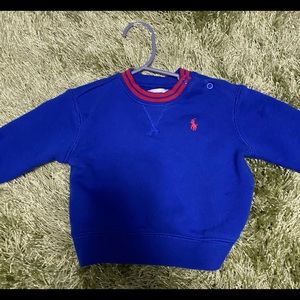 Red and blue polo sweater